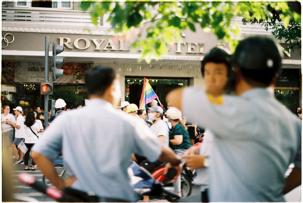 Busy Ho Chi Minh City street filled with people, showcasing a lively urban atmosphere.